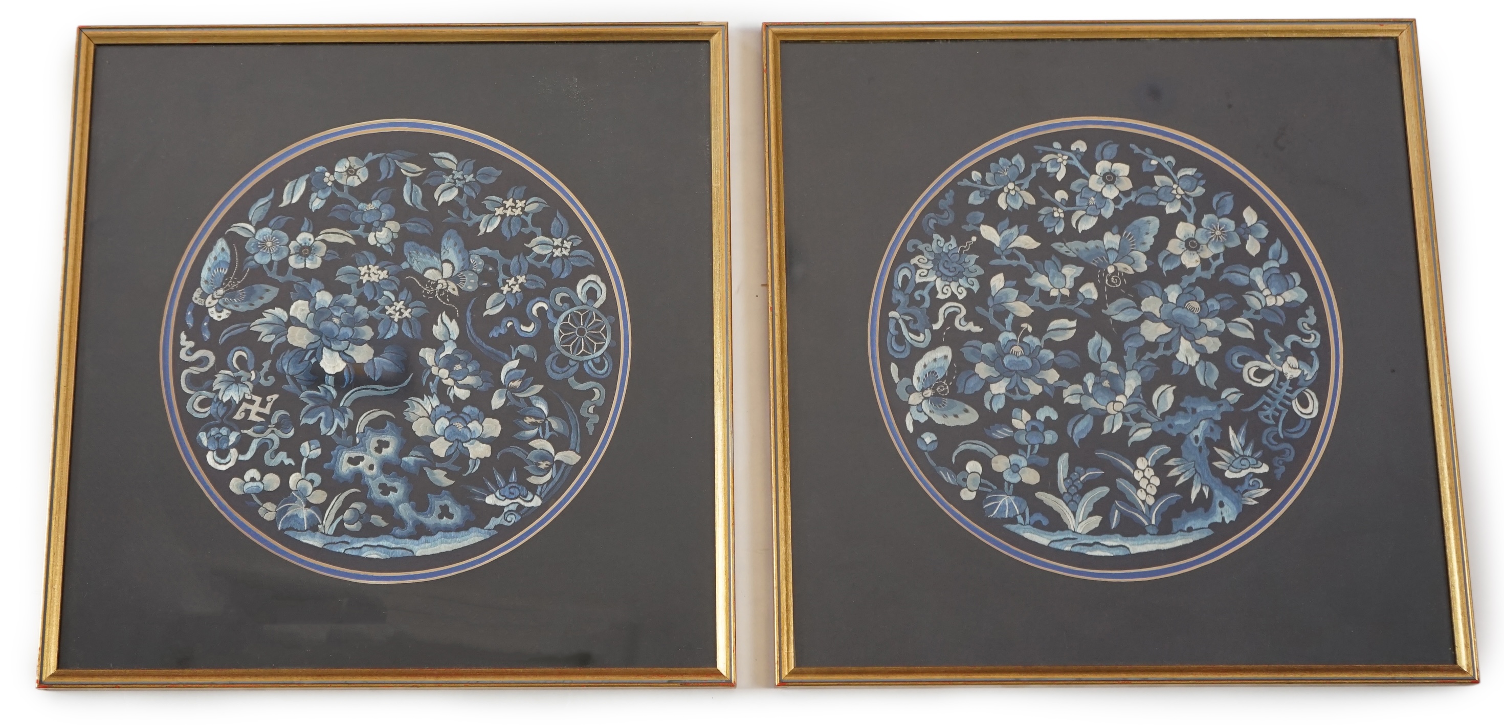 A pair of Chinese embroidered silk roundels, mid 19th century